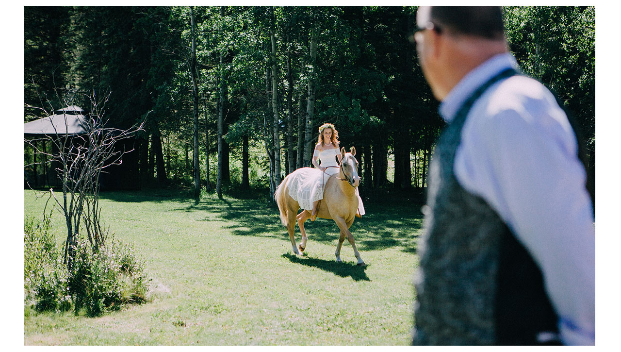 Bride riding in on horse