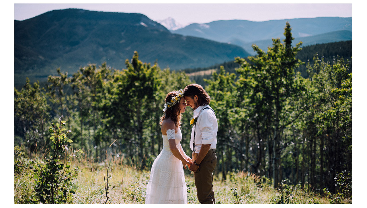 Bride and groom overlooking canadian rockies